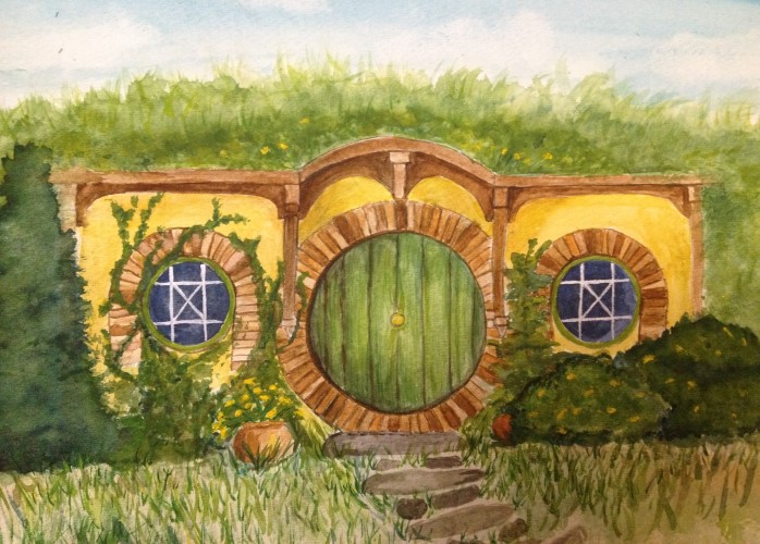 hobbit-holed, painted green, with a shiny yellow knob in the exact middle.